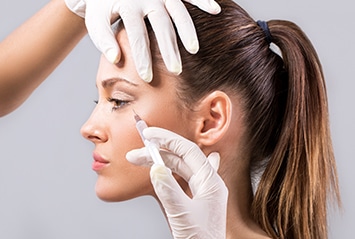 woman receiving injectable treatment