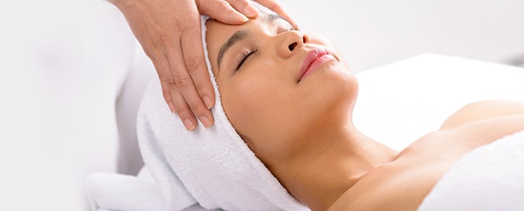 Woman receiving facial treatment - Facial Hollywood FL