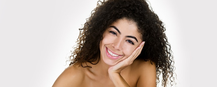 Woman smiling after mircodermabrasion