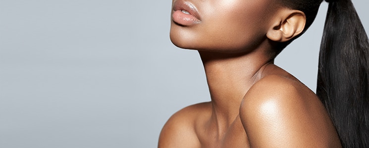 closeup image of woman's neck after getting kybella treatments