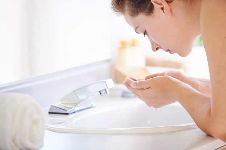 woman washing face