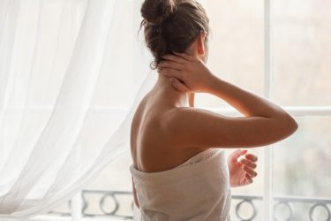 woman with clear skin in towel