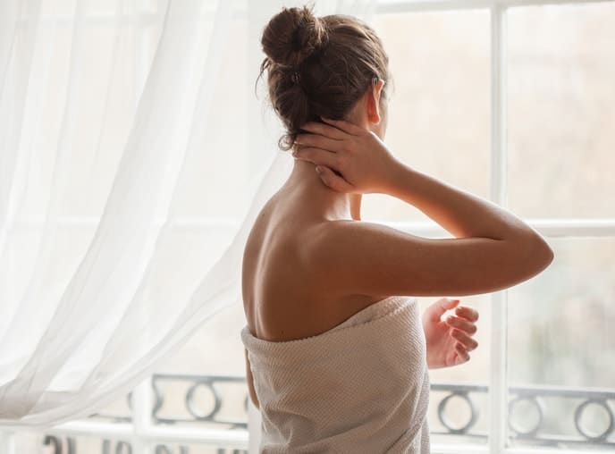 woman with clear skin in towel