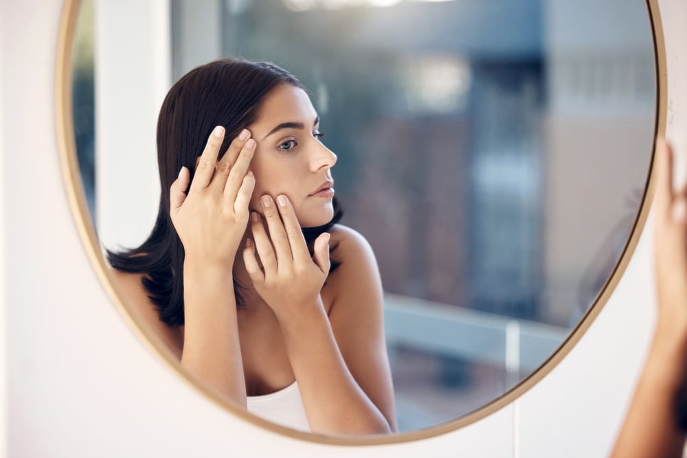 Skincare,,Facial,And,Woman,By,A,Mirror,To,Check,For